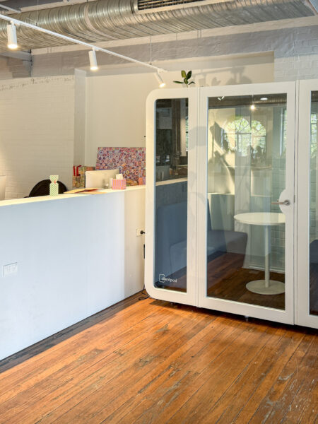 Interior view of a modern office with a newly installed Silent Pod Collab Pod, enhancing workspace flexibility in a heritage building in Surry Hills.