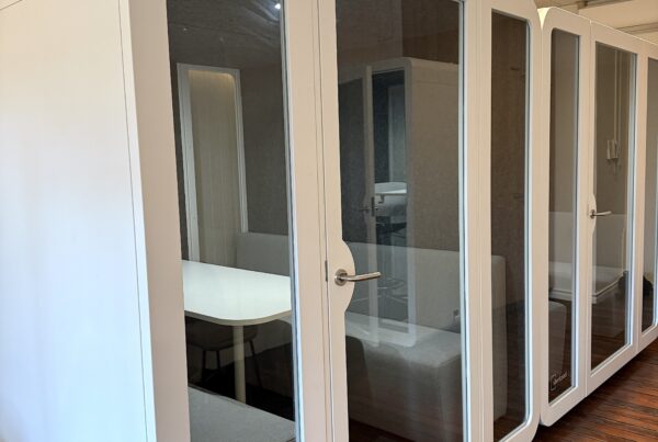 Boardroom privacy pods on site, with couches and a table, suitable for up to 8 people.