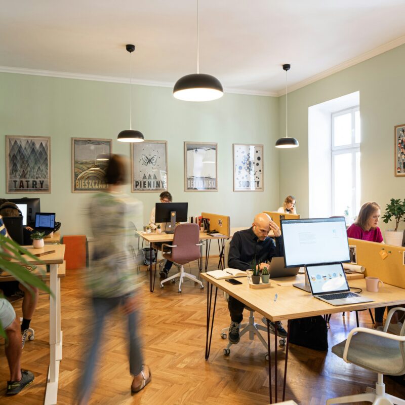 An open plan office working space, with no private booth to work in.